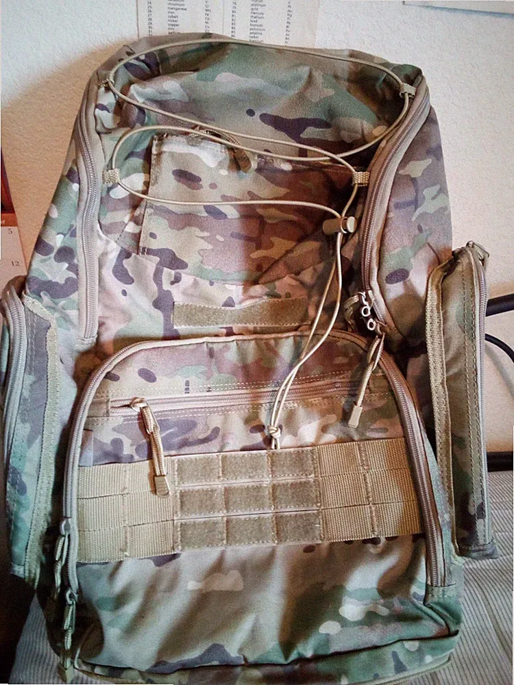 Camouflage Backpack,Rucksack, xl brown poncho and 9.5 Black boots,All are new